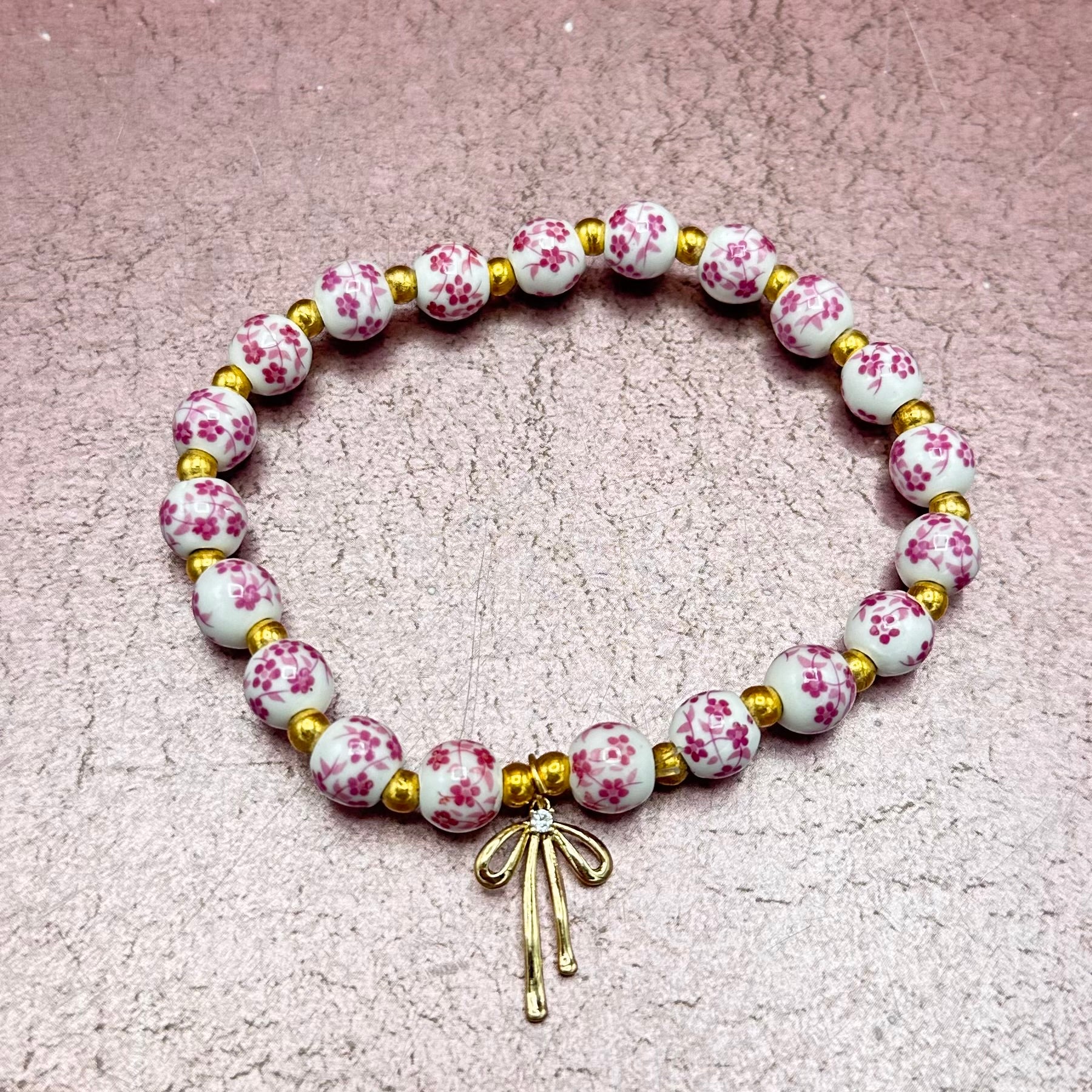 Flower Bead w/ Gold Bow Bracelet